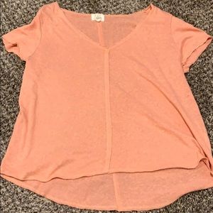 Peach colored shirt